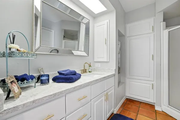 a kitchen with stainless steel appliances granite countertop a sink dishwasher and cabinets with wooden floor