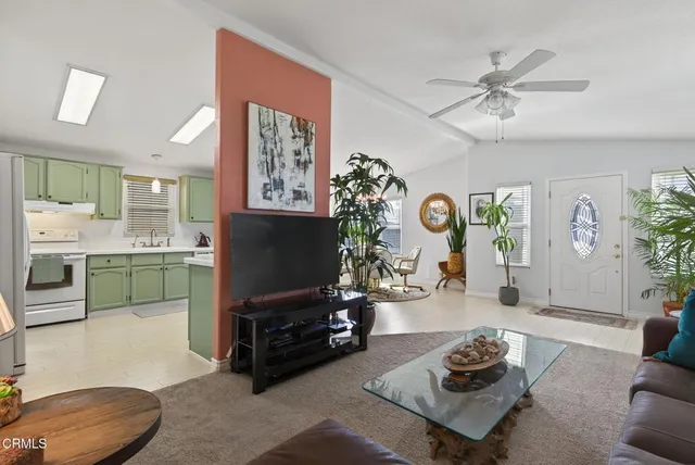 a kitchen with a refrigerator and a sink