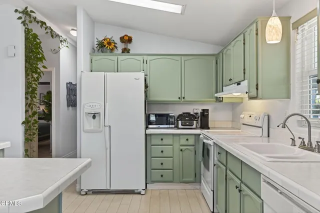 a view of a kitchen area with furniture and window