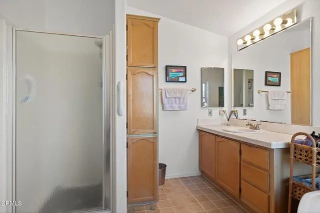 a view of walk in closet with clothes