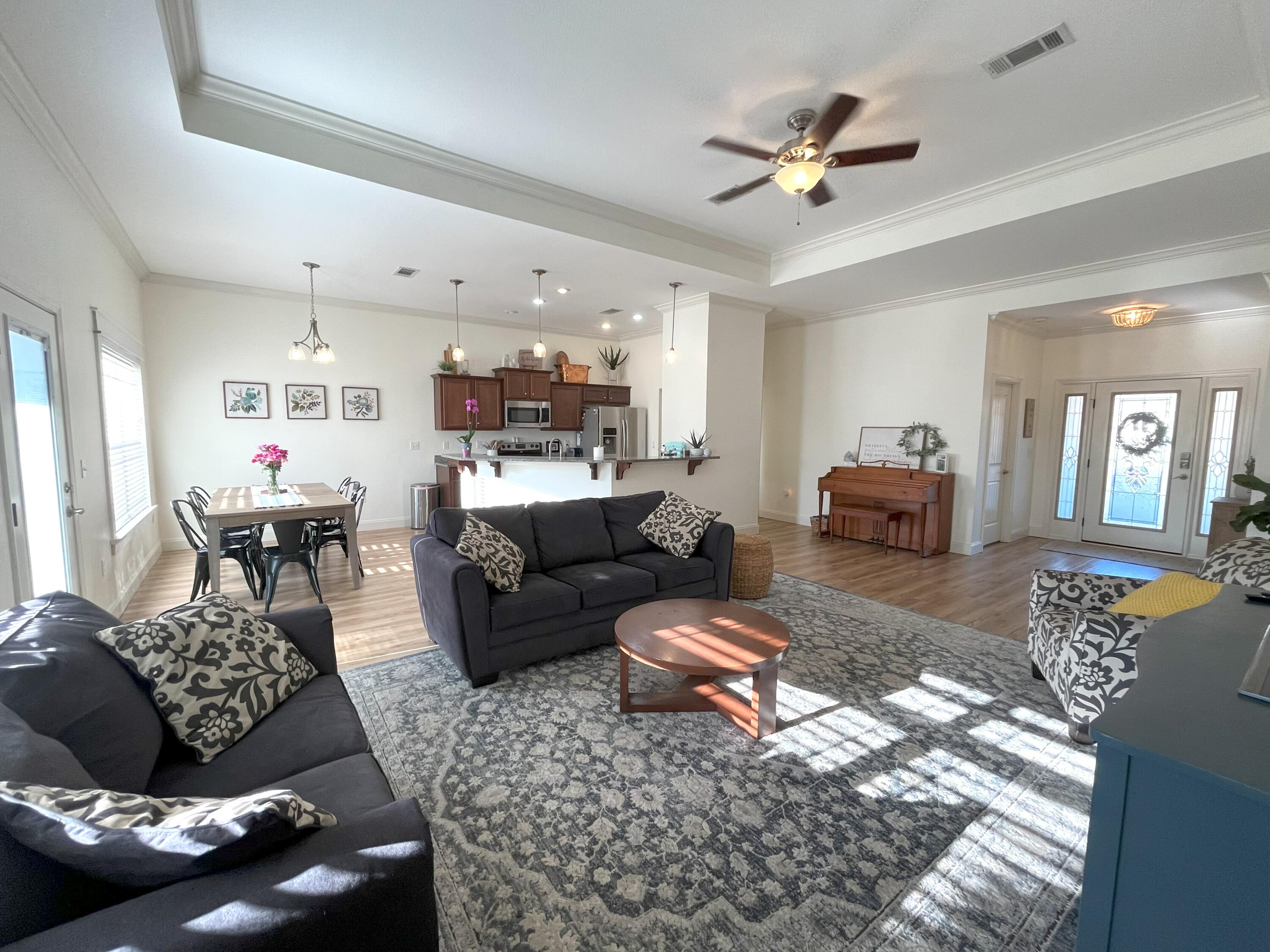 4589 Hermosa Road Crestview, FL 32539 - Photo 3 of 34 a living room with furniture and a rug