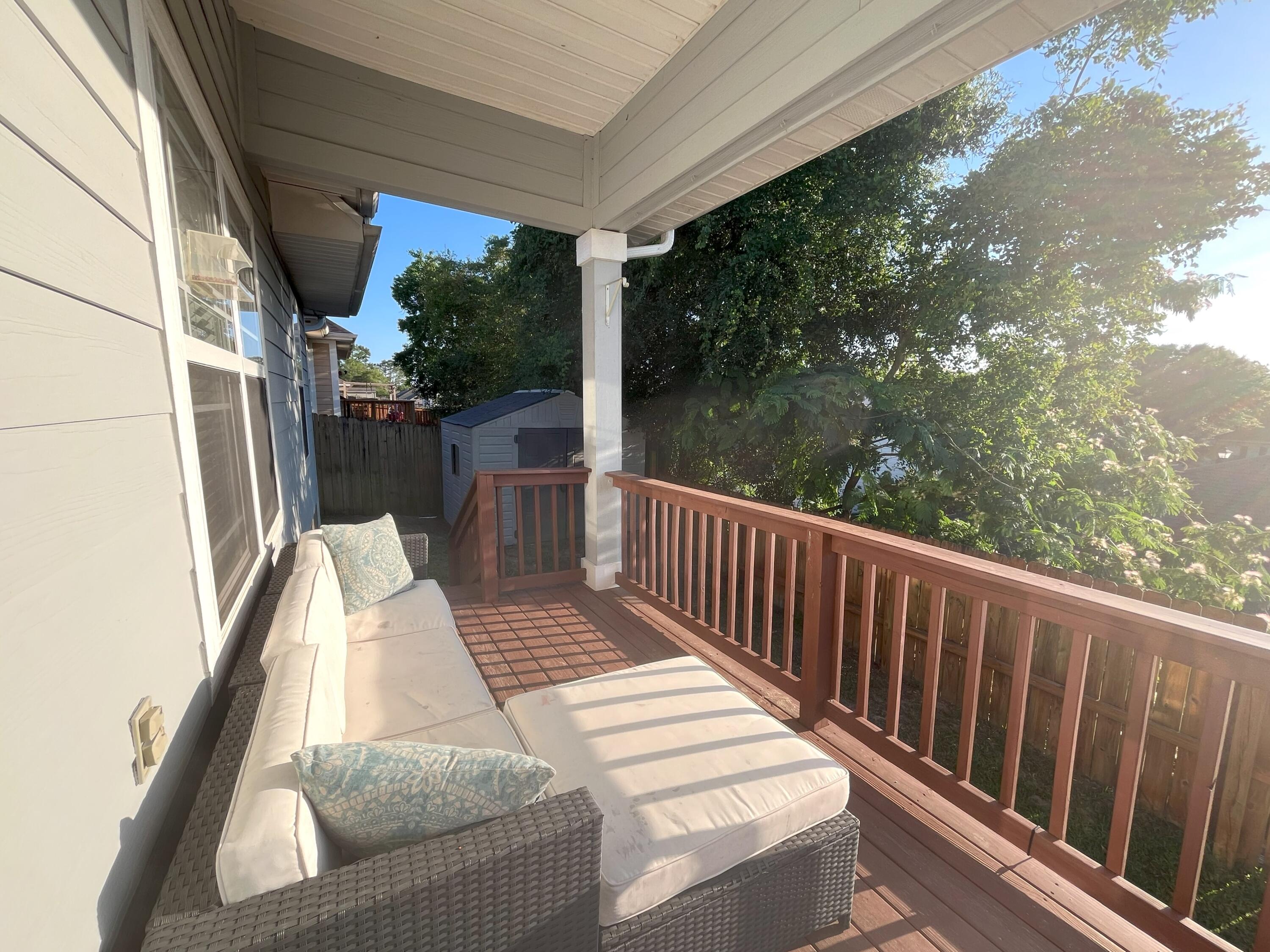 4589 Hermosa Road Crestview, FL 32539 - Photo 32 of 34 a view of balcony with wooden floor and outdoor seating