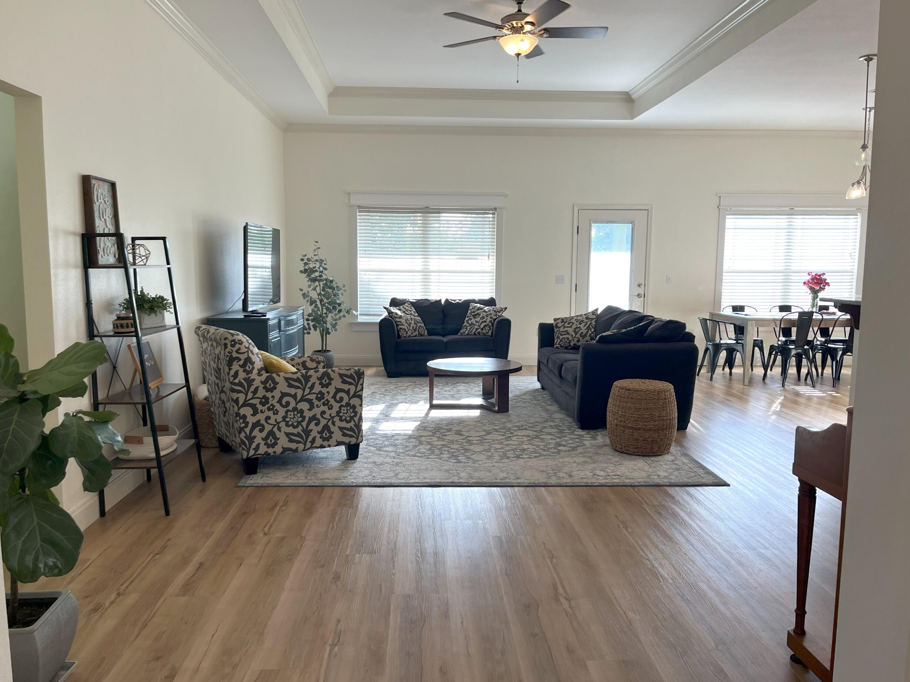 4589 Hermosa Road Crestview, FL 32539 - Photo 5 of 34 a living room with furniture rug and window