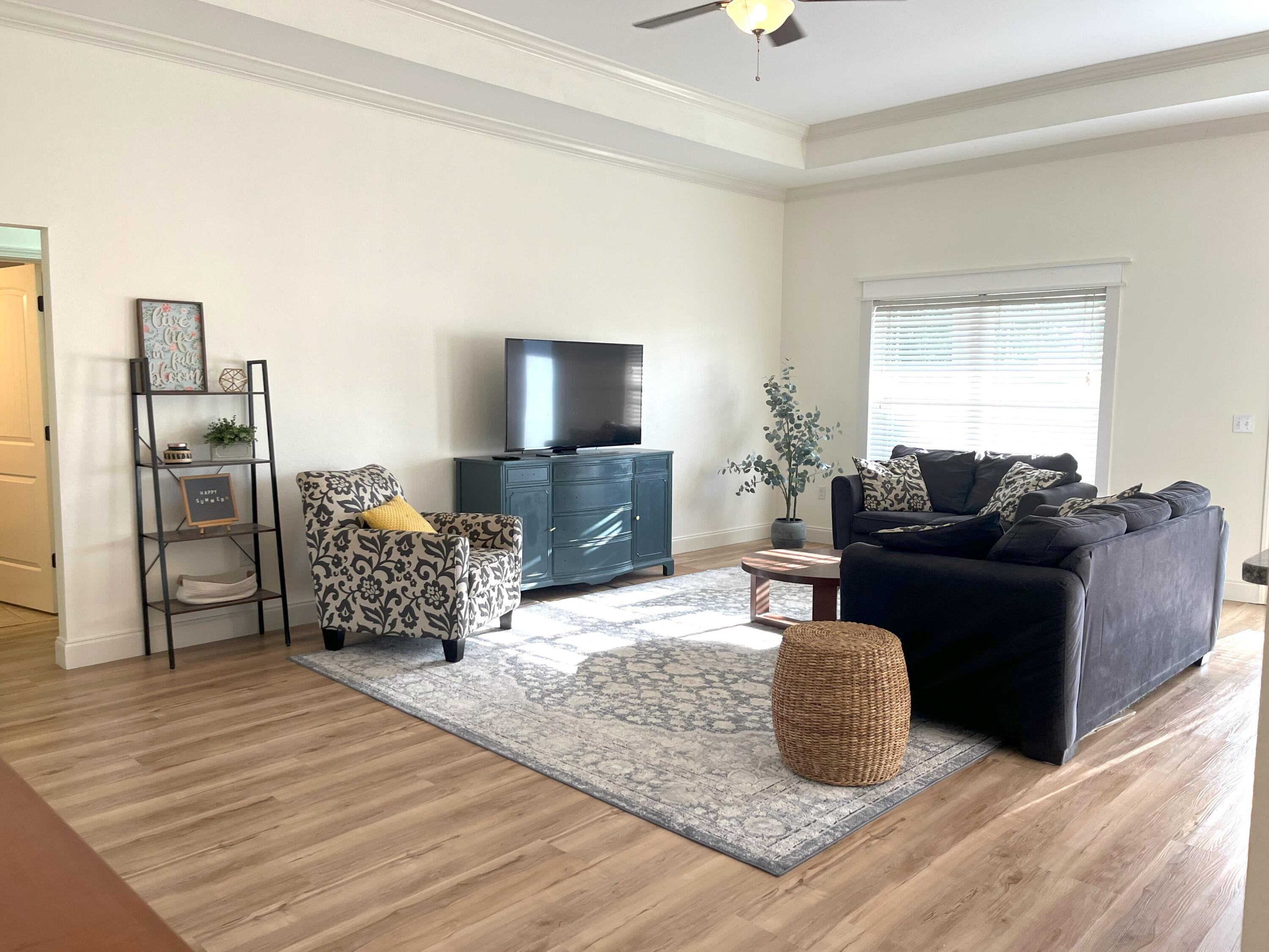 4589 Hermosa Road Crestview, FL 32539 - Photo 6 of 34 a living room with furniture and a flat screen tv