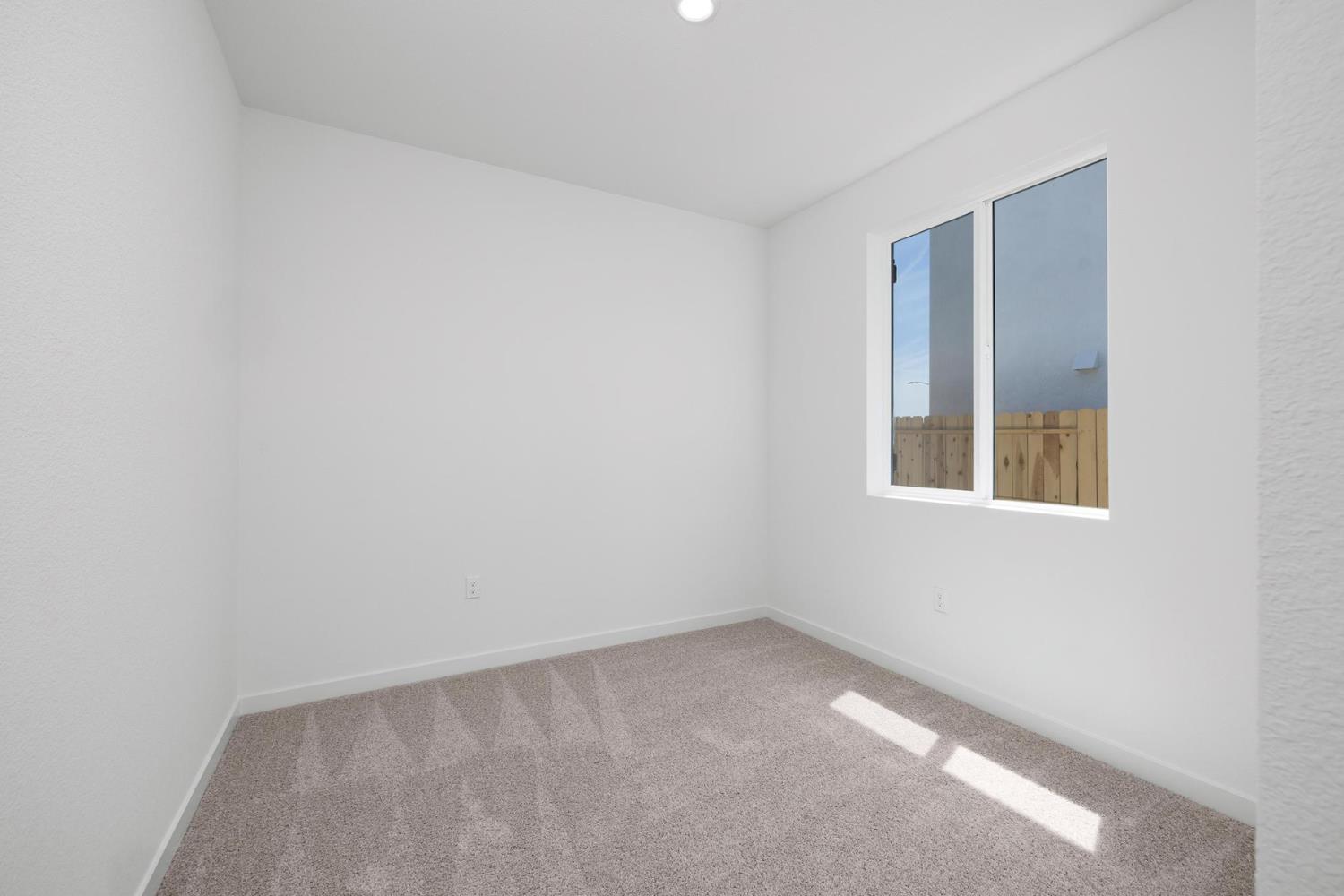 809 Chatham Lane Patterson, CA 95363 - Photo 14 of 16 a view of an empty room with a window