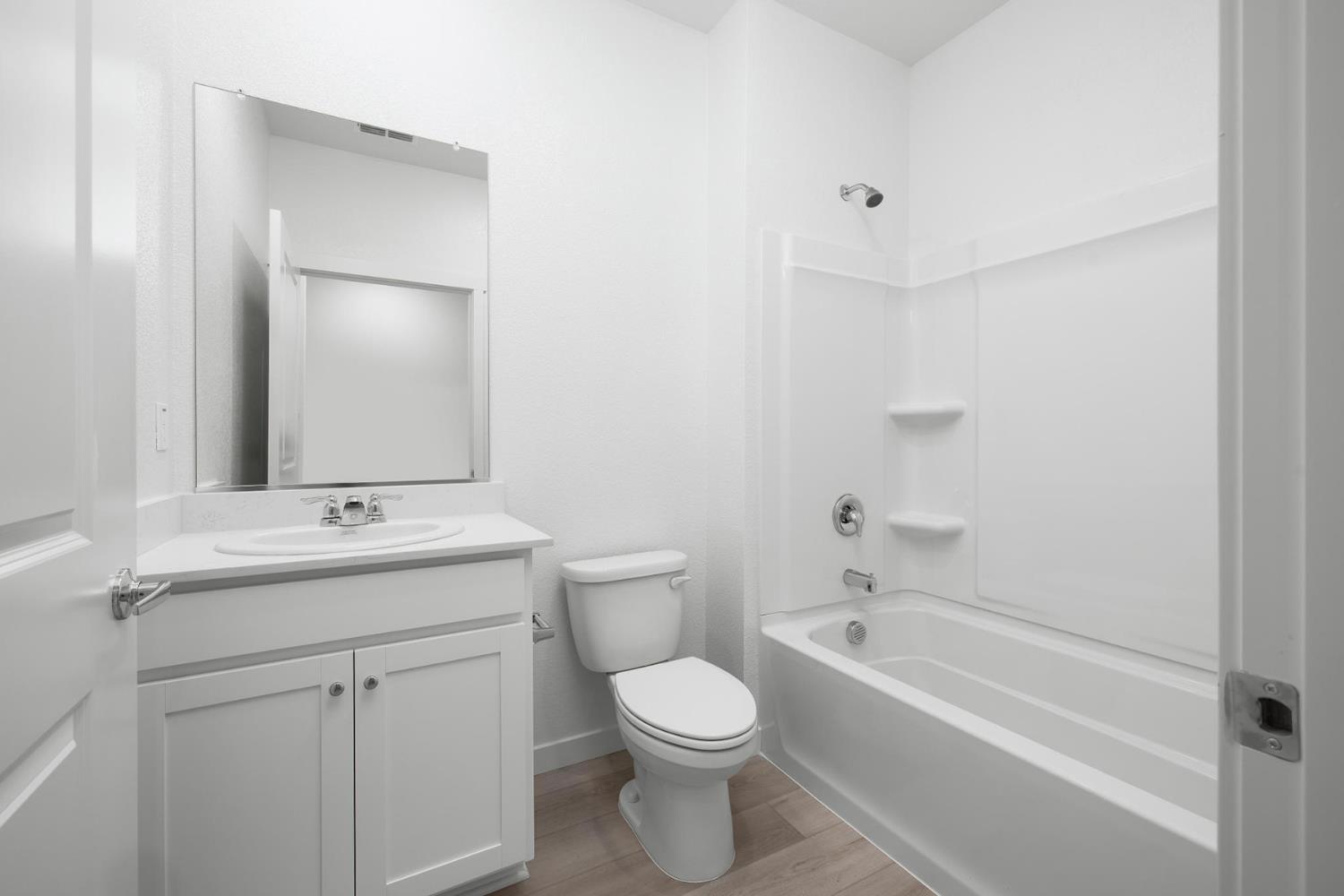 809 Chatham Lane Patterson, CA 95363 - Photo 15 of 16 a bathroom with a sink toilet and shower