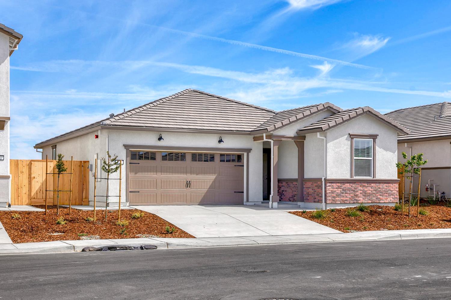 809 Chatham Lane Patterson, CA 95363 - Photo 2 of 16 a front view of a house with a garden