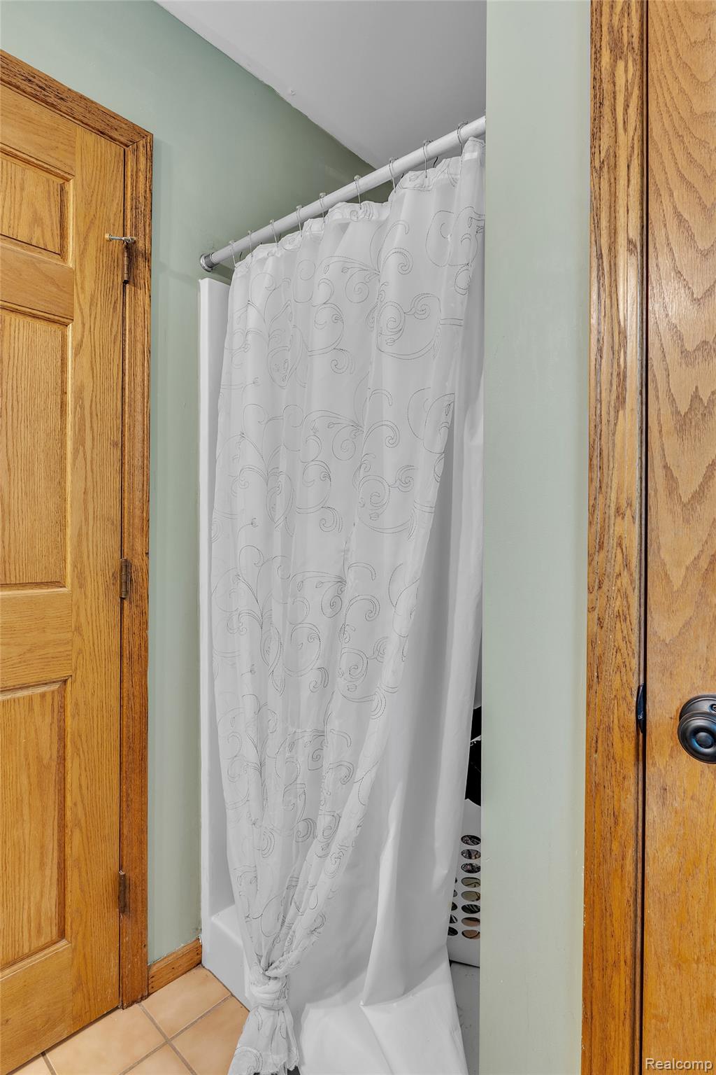 1345 Ives Road Mason, MI 48854 - Photo 27 of 92 Full bath featuring a stall shower and light tile patterned floors