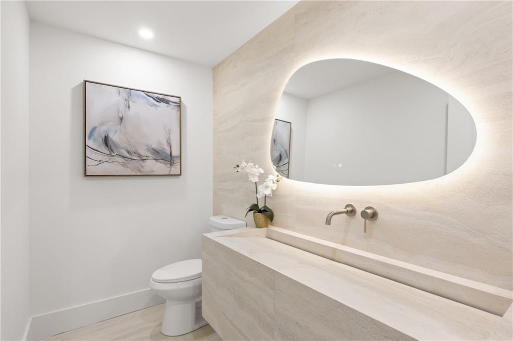 8120 Ball Mill Road Northeast Atlanta, GA 30350 - Photo 45 of 95 a bathroom with a toilet sink and mirror
