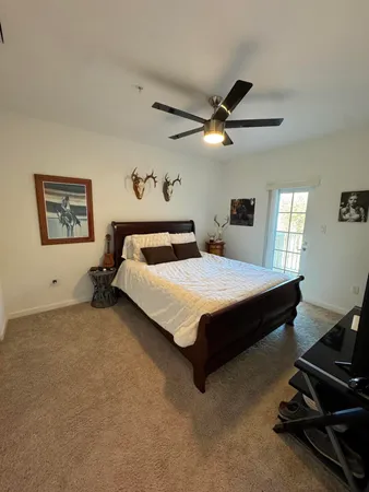 a bedroom with a bed furniture and a window