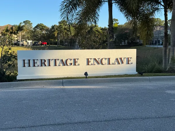 a sign that is sitting on a sidewalk