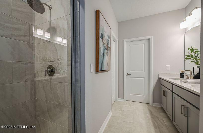 299 Cherry Elm Drive St. Augustine, FL 32092 - Photo 17 of 18 a bathroom with a sink and mirror