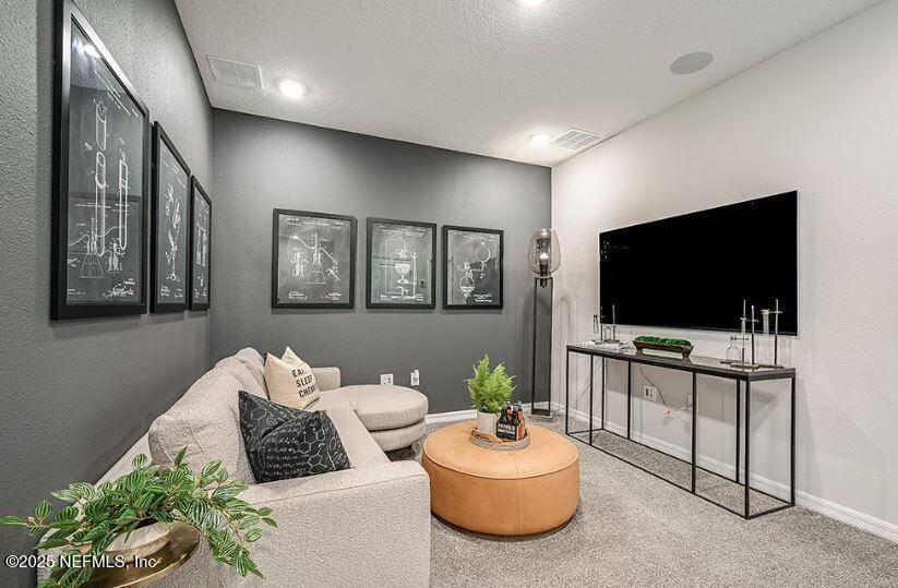 299 Cherry Elm Drive St. Augustine, FL 32092 - Photo 10 of 18 a living room with furniture and a flat screen tv