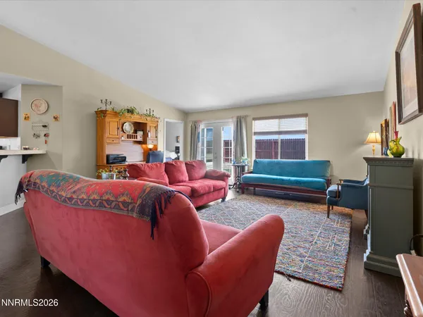 a bedroom with furniture and wooden floor