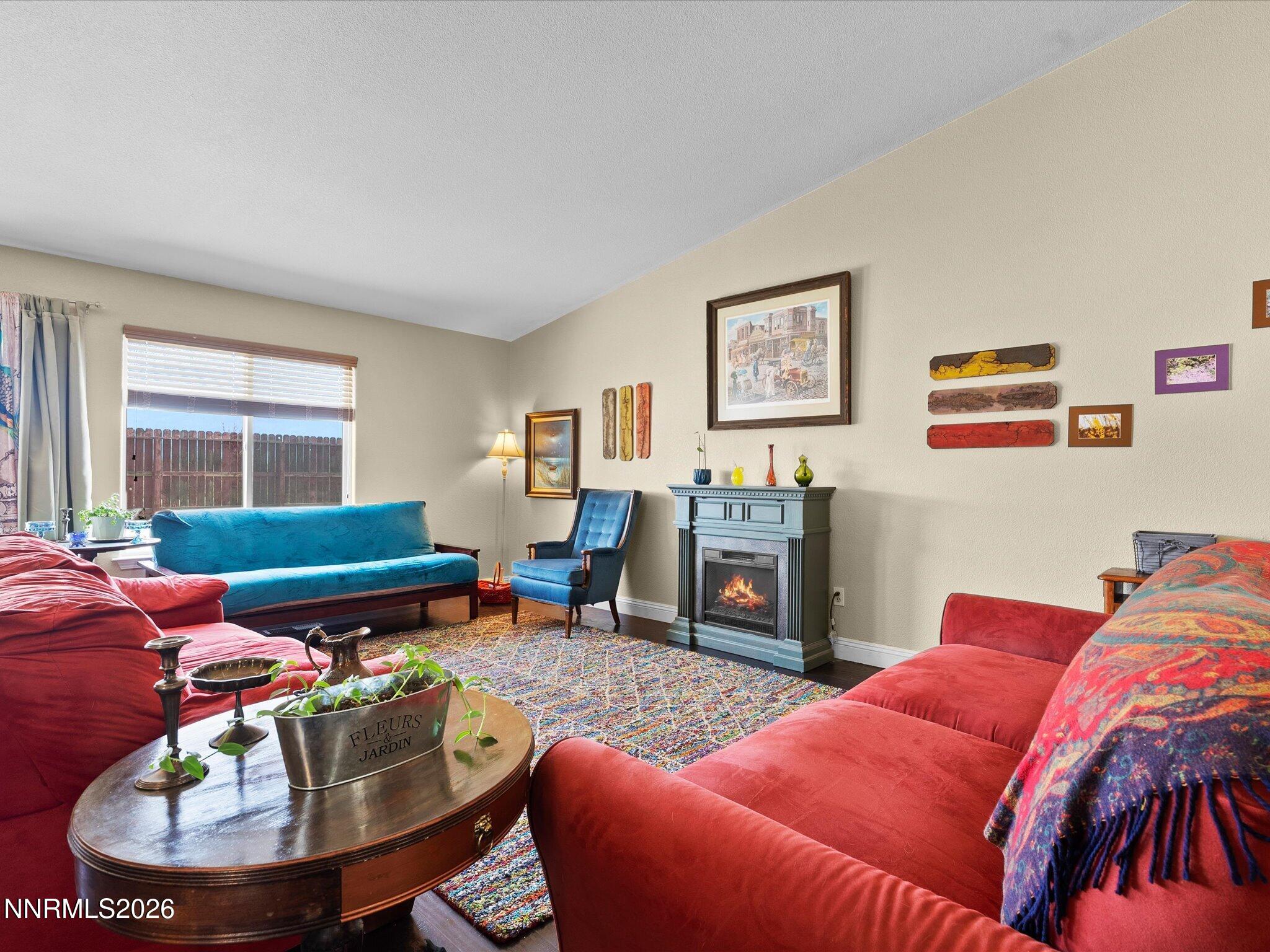 710 Keppel Street Fallon, NV 89406 - Photo 15 of 38 a living room with furniture a window and a fireplace