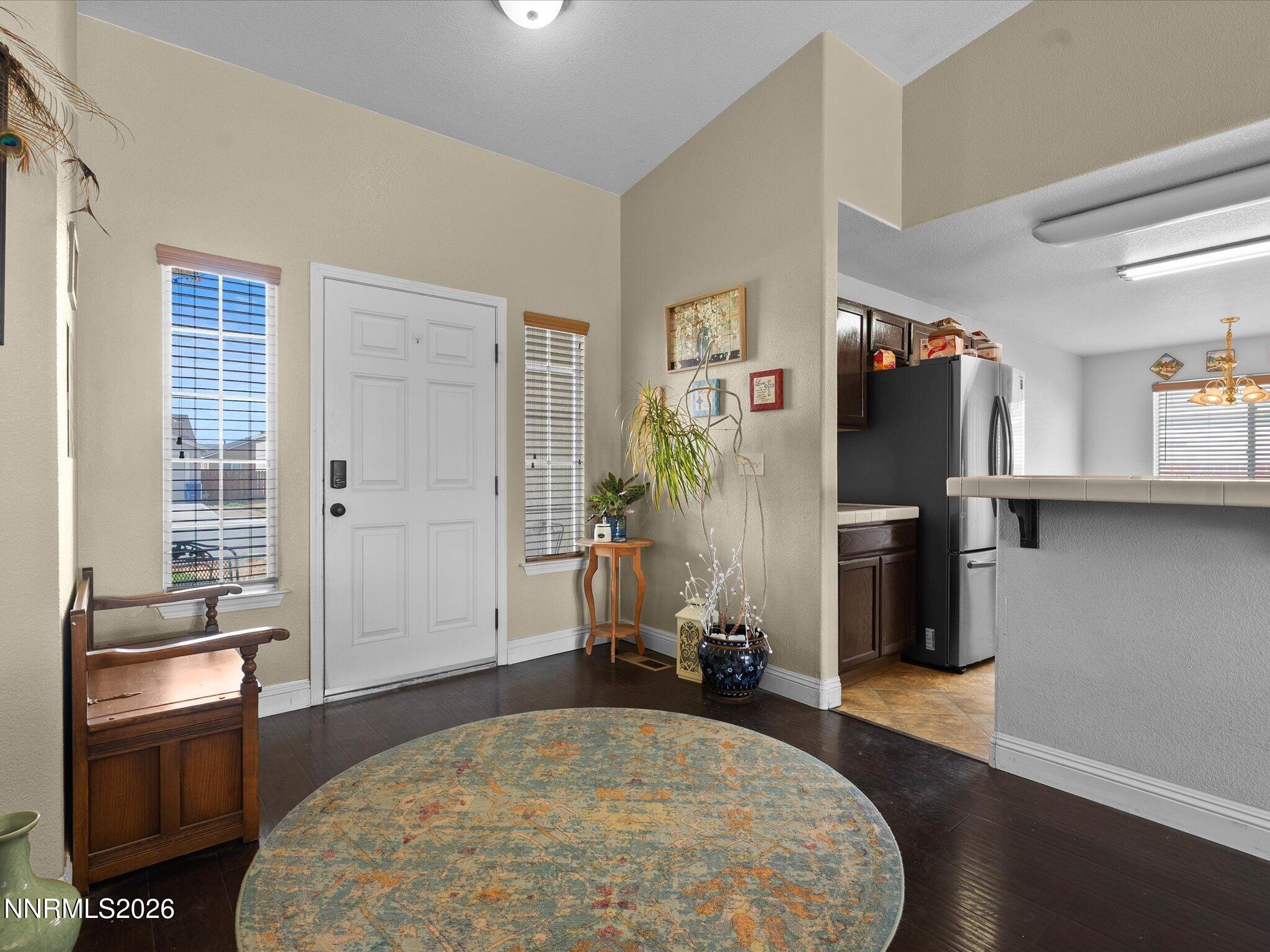710 Keppel Street Fallon, NV 89406 - Photo 18 of 38 a spacious bedroom with a bed and wooden floor