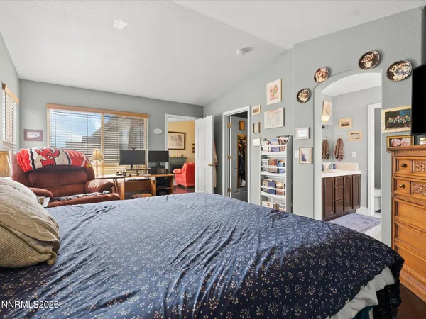 a bed room with a bed and a couch