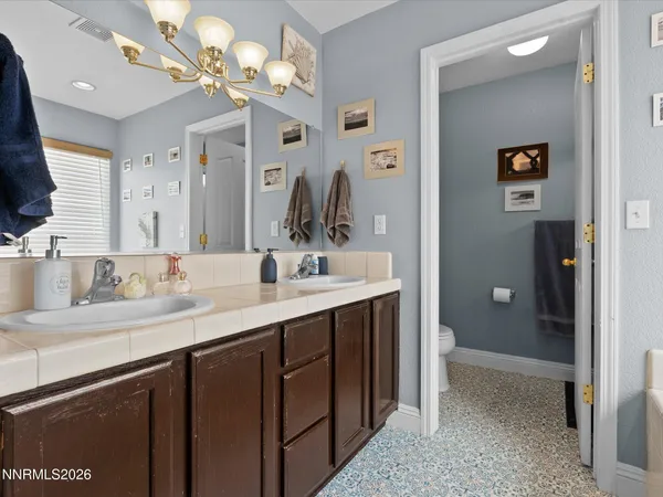 a bathroom with a sink a vanity and a mirror