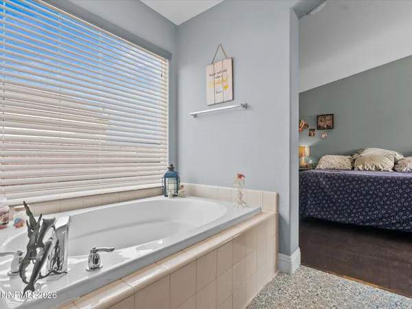 a bathroom with a tub and a sink