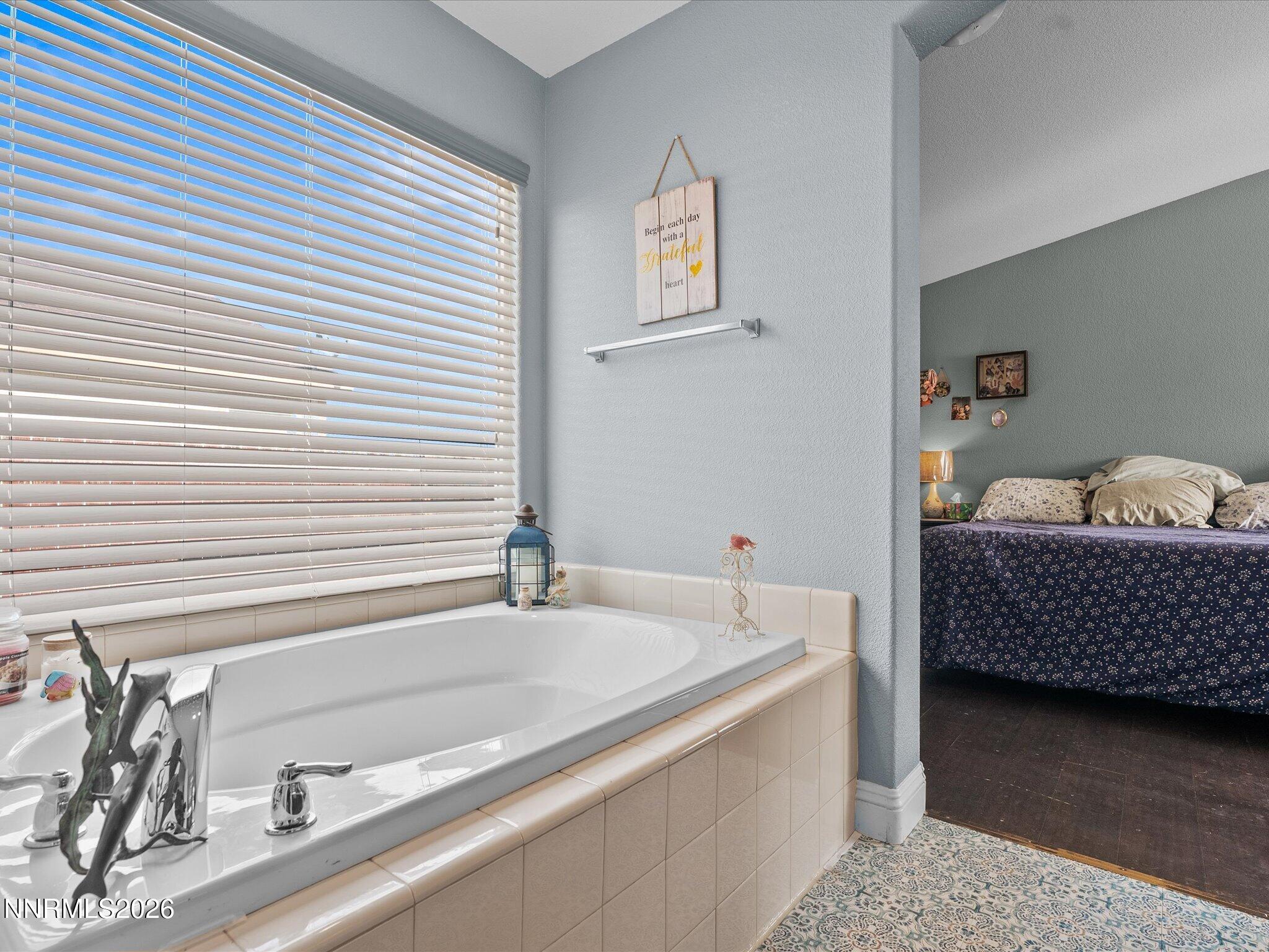 710 Keppel Street Fallon, NV 89406 - Photo 24 of 38 a bathroom with a tub and a sink