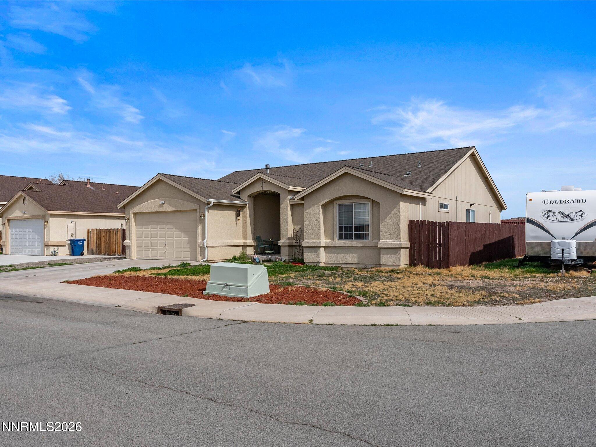 710 Keppel Street Fallon, NV 89406 - Photo 3 of 38 a front view of a house with a yard