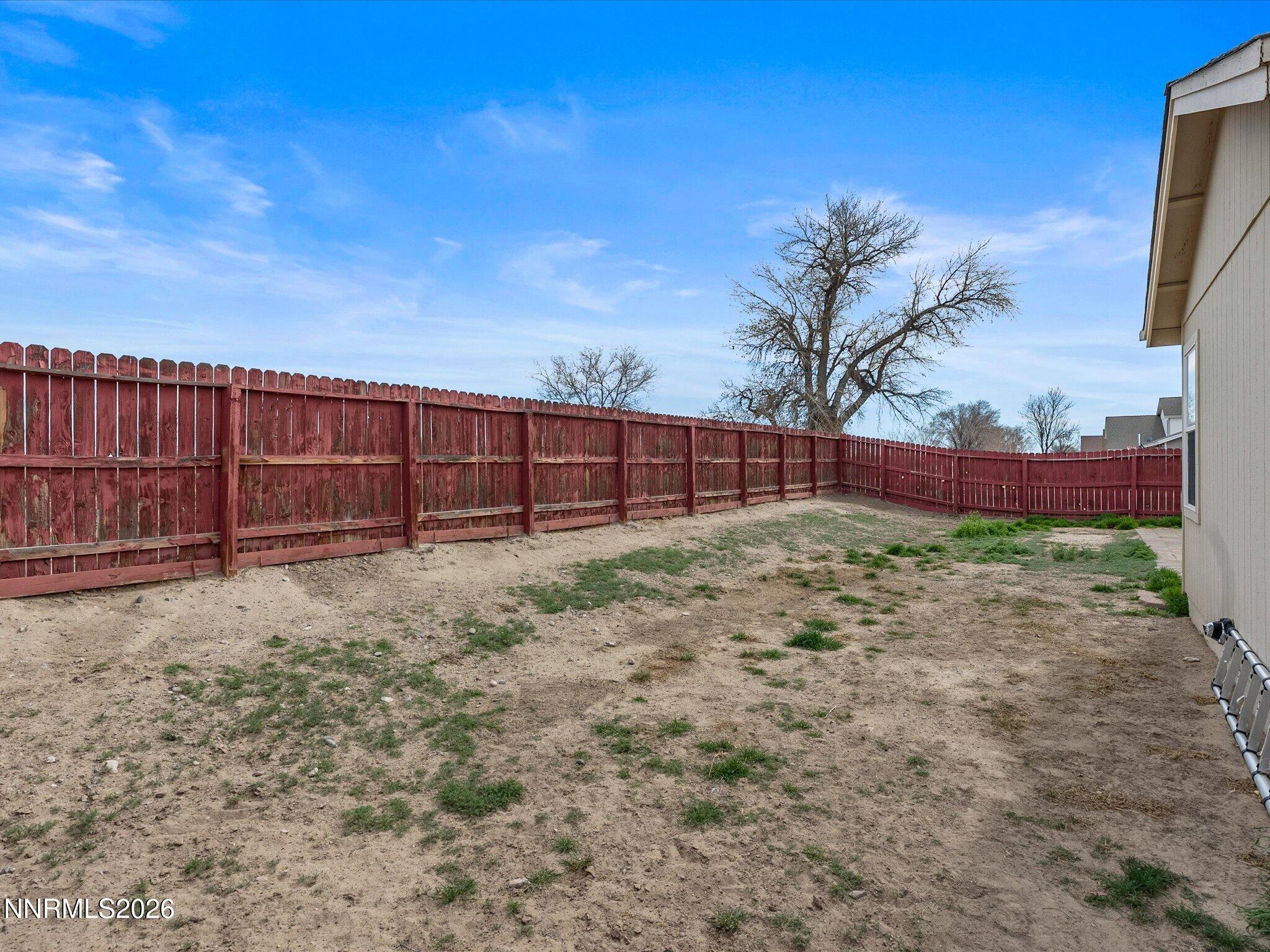 710 Keppel Street Fallon, NV 89406 - Photo 35 of 38 a view of backyard with wooden fence