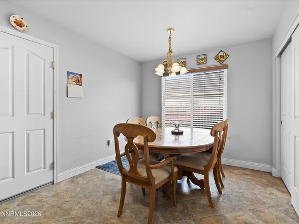 a view of a dining room with furniture and window