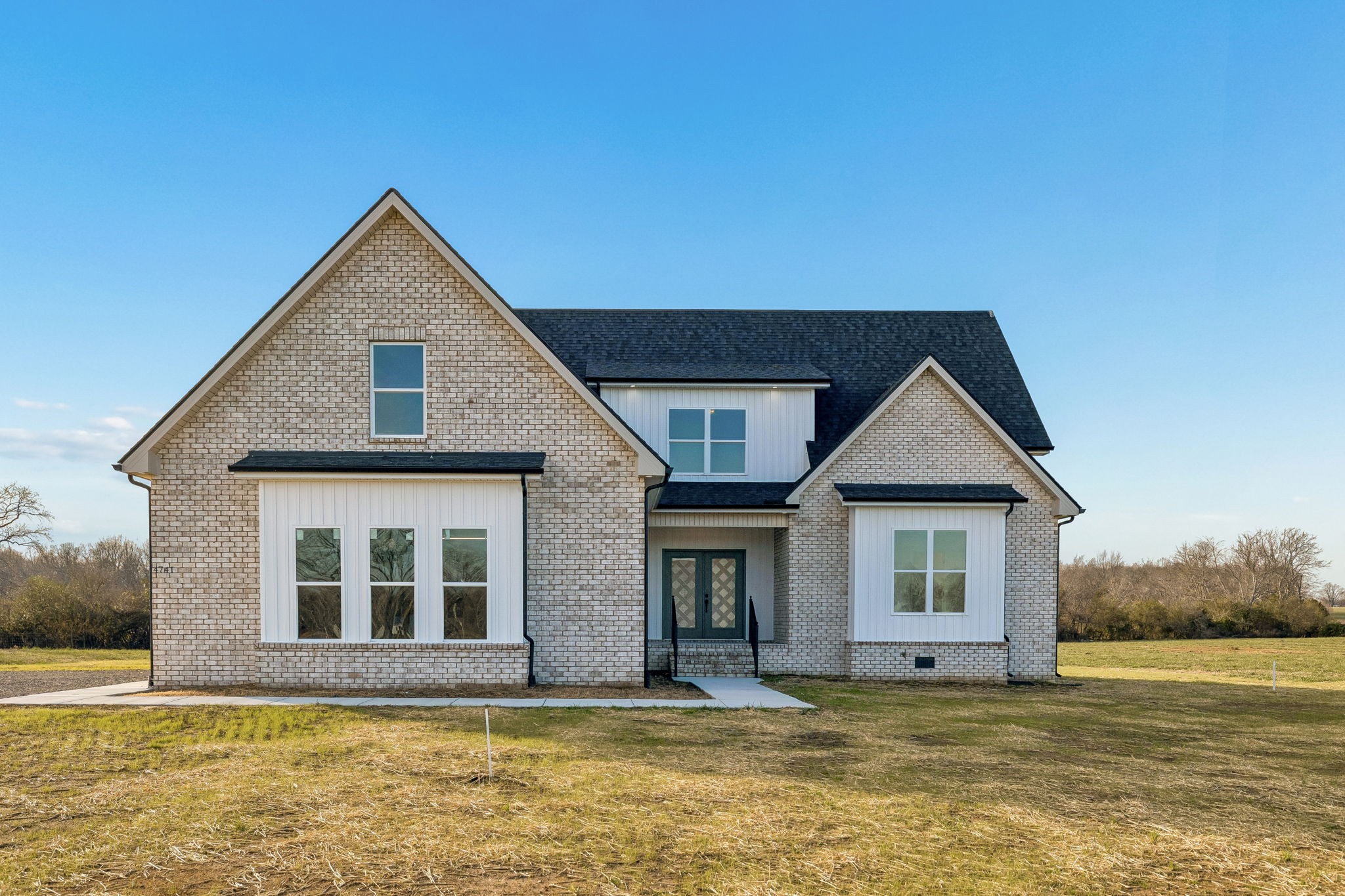 a front view of a house with a yard