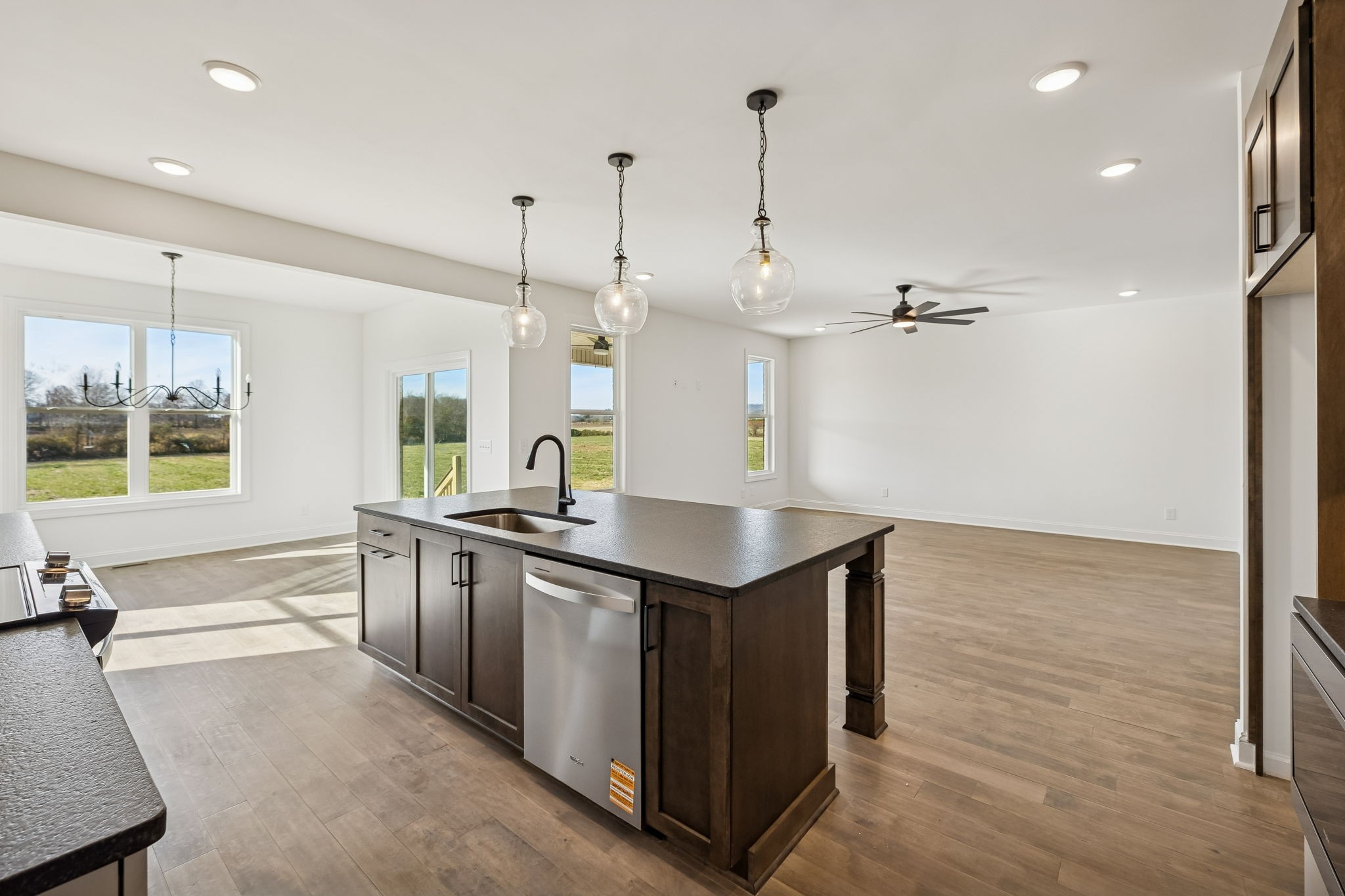 4741 Short Mountain Road Woodbury, TN 37190 - Photo 15 of 56 a large kitchen with kitchen island a large counter space wooden floor and appliances