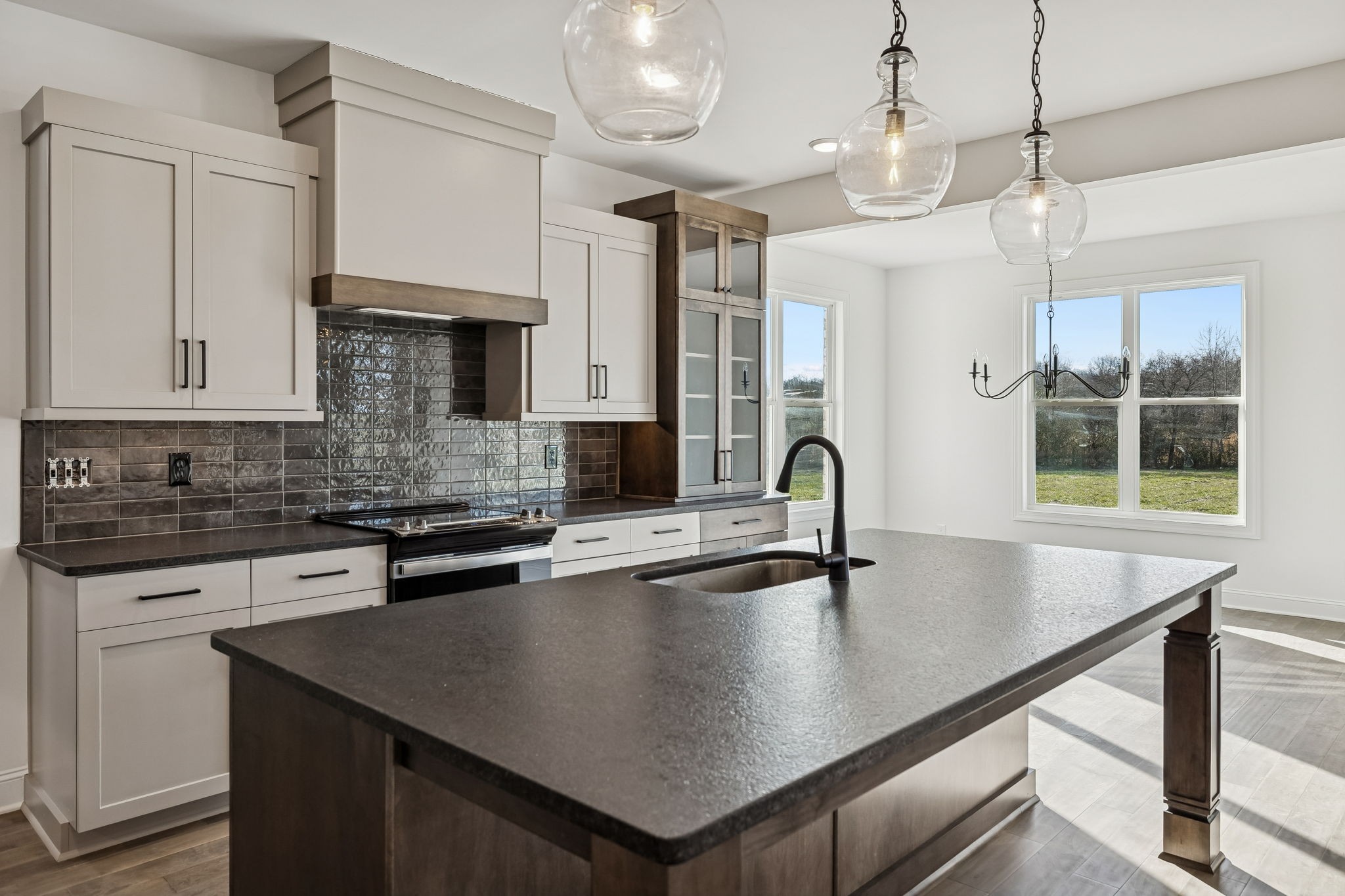 4741 Short Mountain Road Woodbury, TN 37190 - Photo 16 of 56 a kitchen with stainless steel appliances granite countertop a sink a stove and kitchen island