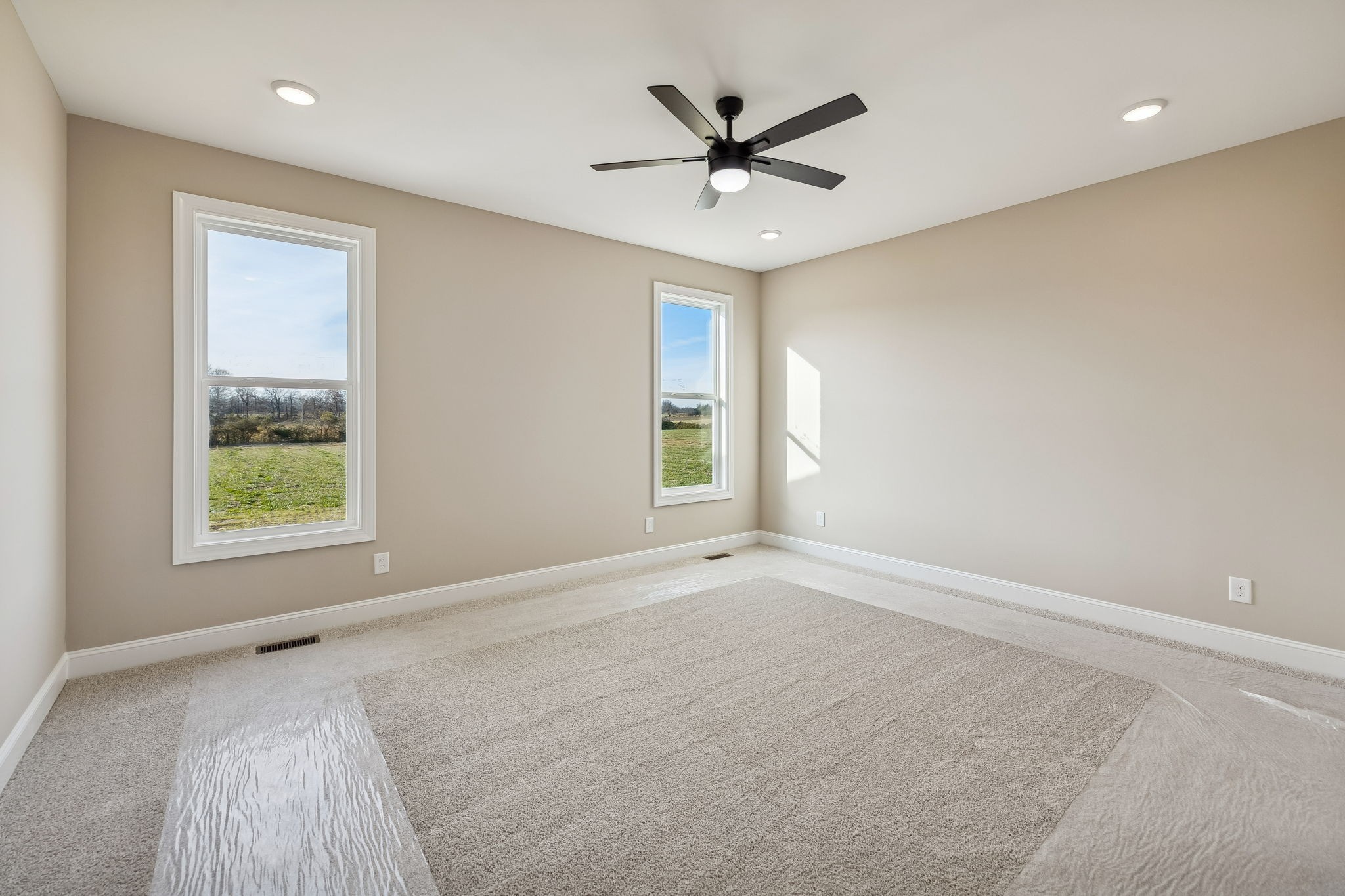 4741 Short Mountain Road Woodbury, TN 37190 - Photo 19 of 56 an empty room with a window and a fan