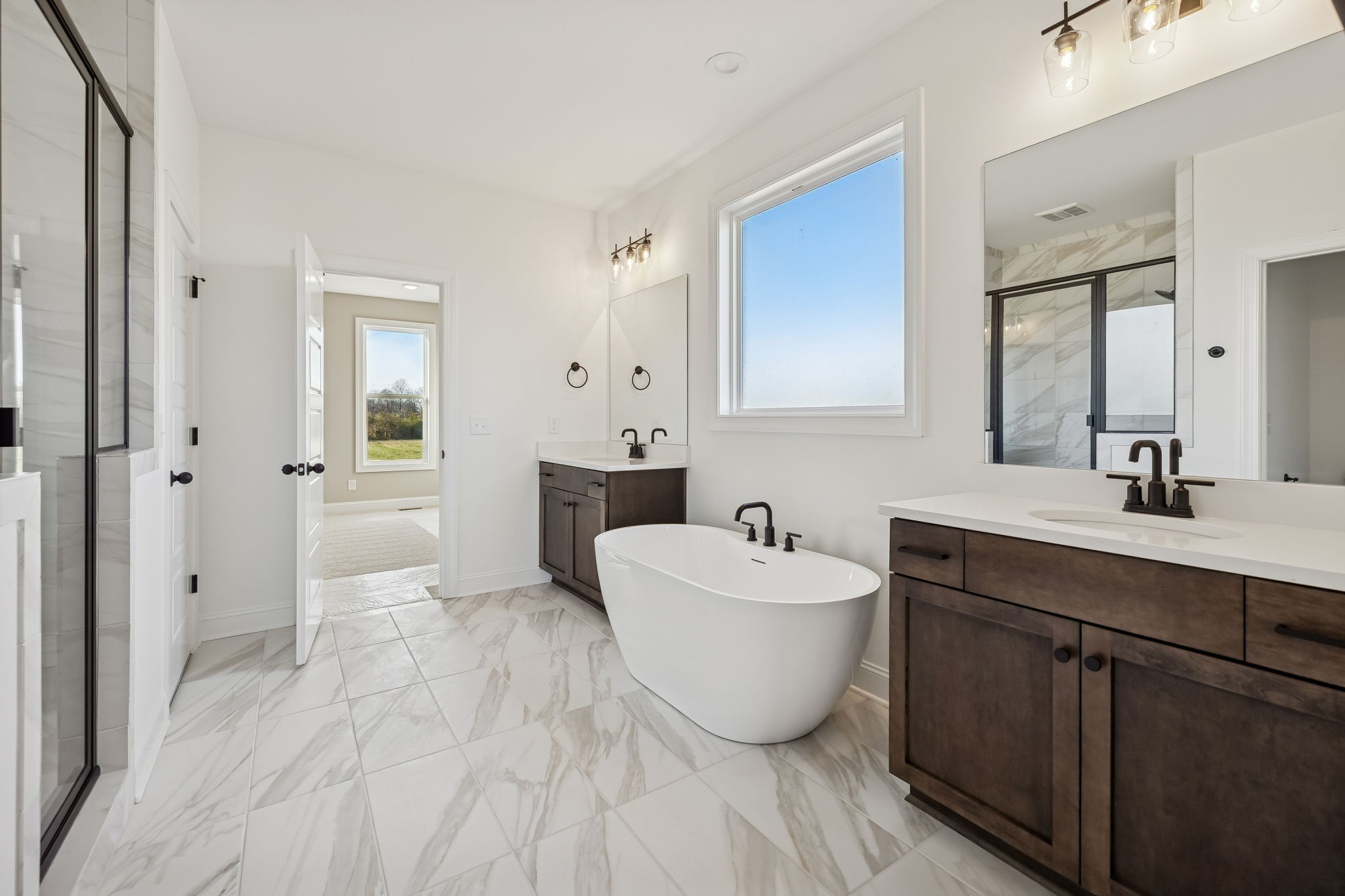 4741 Short Mountain Road Woodbury, TN 37190 - Photo 26 of 56 a spacious bathroom with a double vanity sink mirror and bathtub