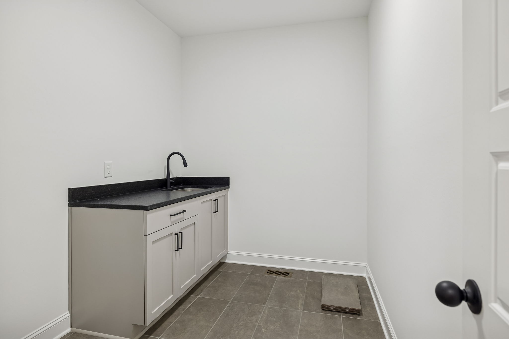 4741 Short Mountain Road Woodbury, TN 37190 - Photo 28 of 56 a utility room with a sink a vanity and mirror