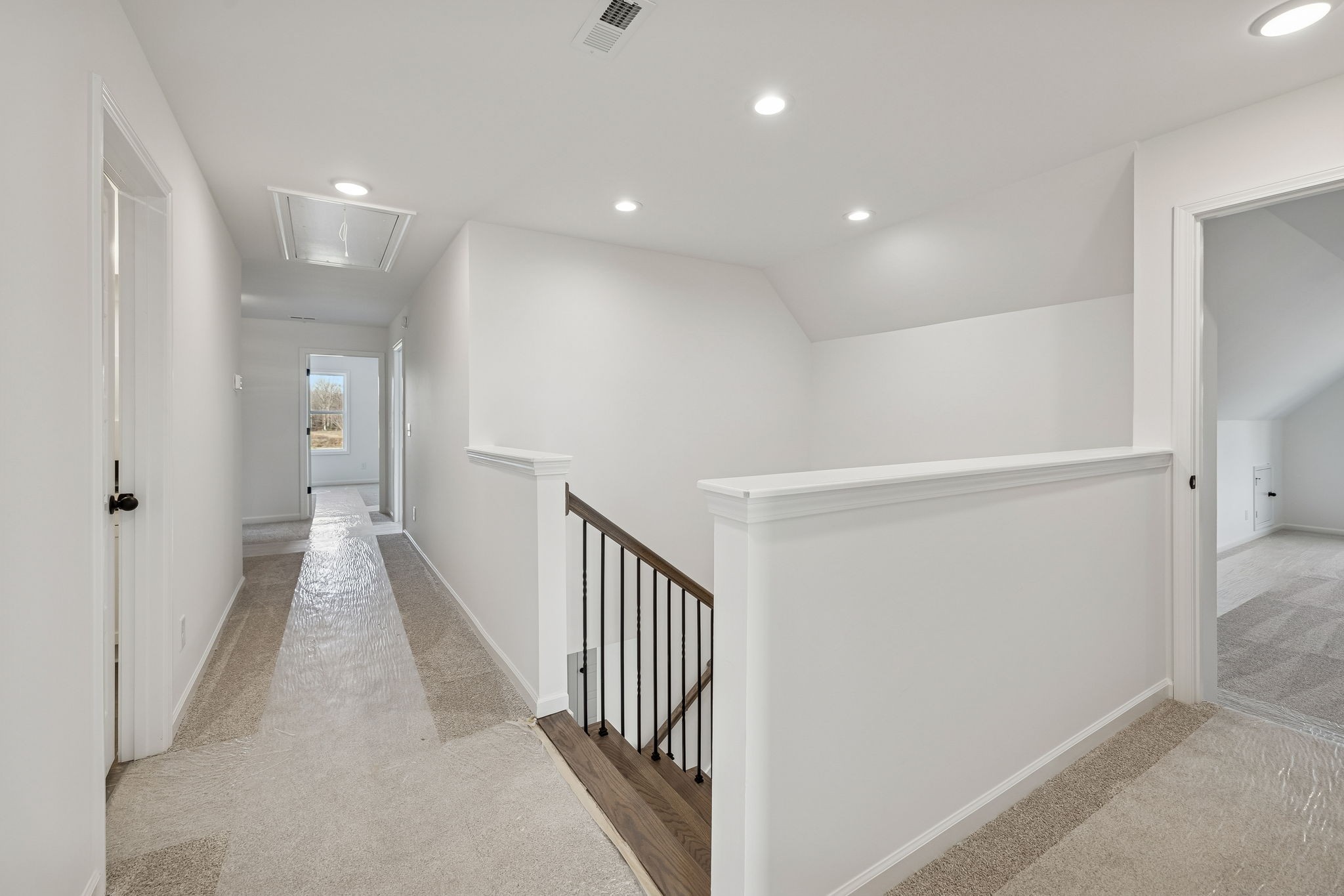4741 Short Mountain Road Woodbury, TN 37190 - Photo 32 of 56 a view of a hallway with wooden floor and staircase