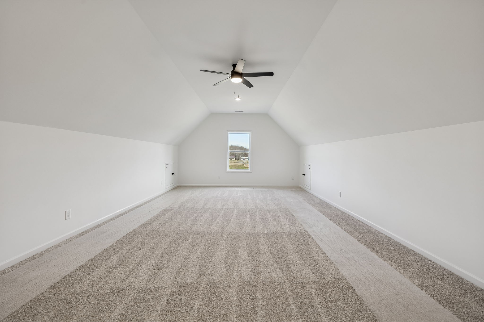 4741 Short Mountain Road Woodbury, TN 37190 - Photo 33 of 56 an empty room with a window and a ceiling fan