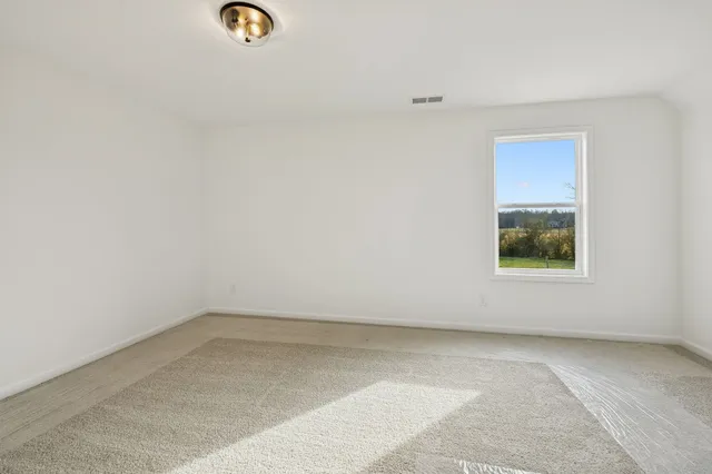 a view of cabinets and window