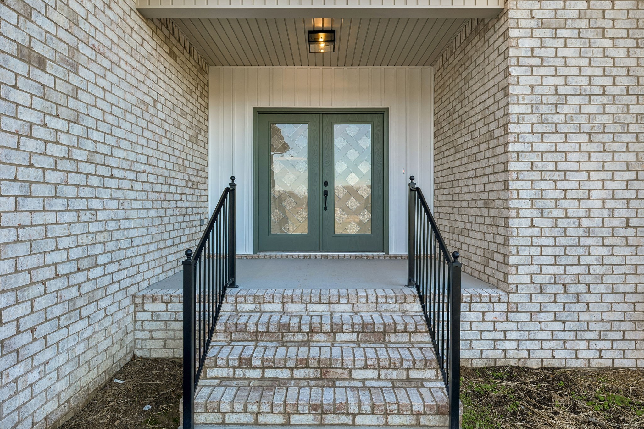 4741 Short Mountain Road Woodbury, TN 37190 - Photo 4 of 56 a view of a brick house with many windows
