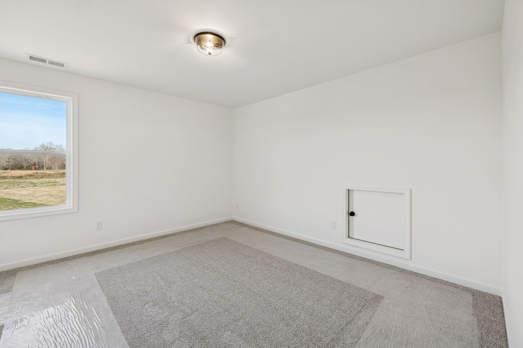 4741 Short Mountain Road Woodbury, TN 37190 - Photo 47 of 56 an empty room with a window