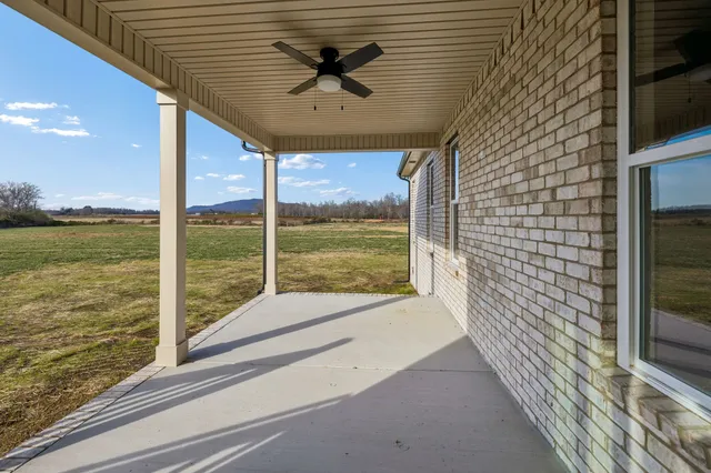 a front view of a house with yard and garage