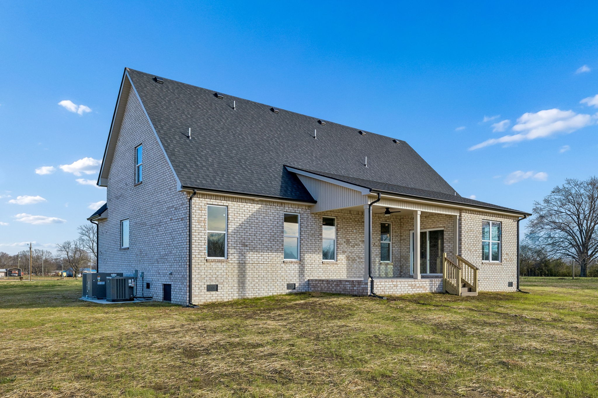 4741 Short Mountain Road Woodbury, TN 37190 - Photo 52 of 56 a view of a house with a big yard and a large tree