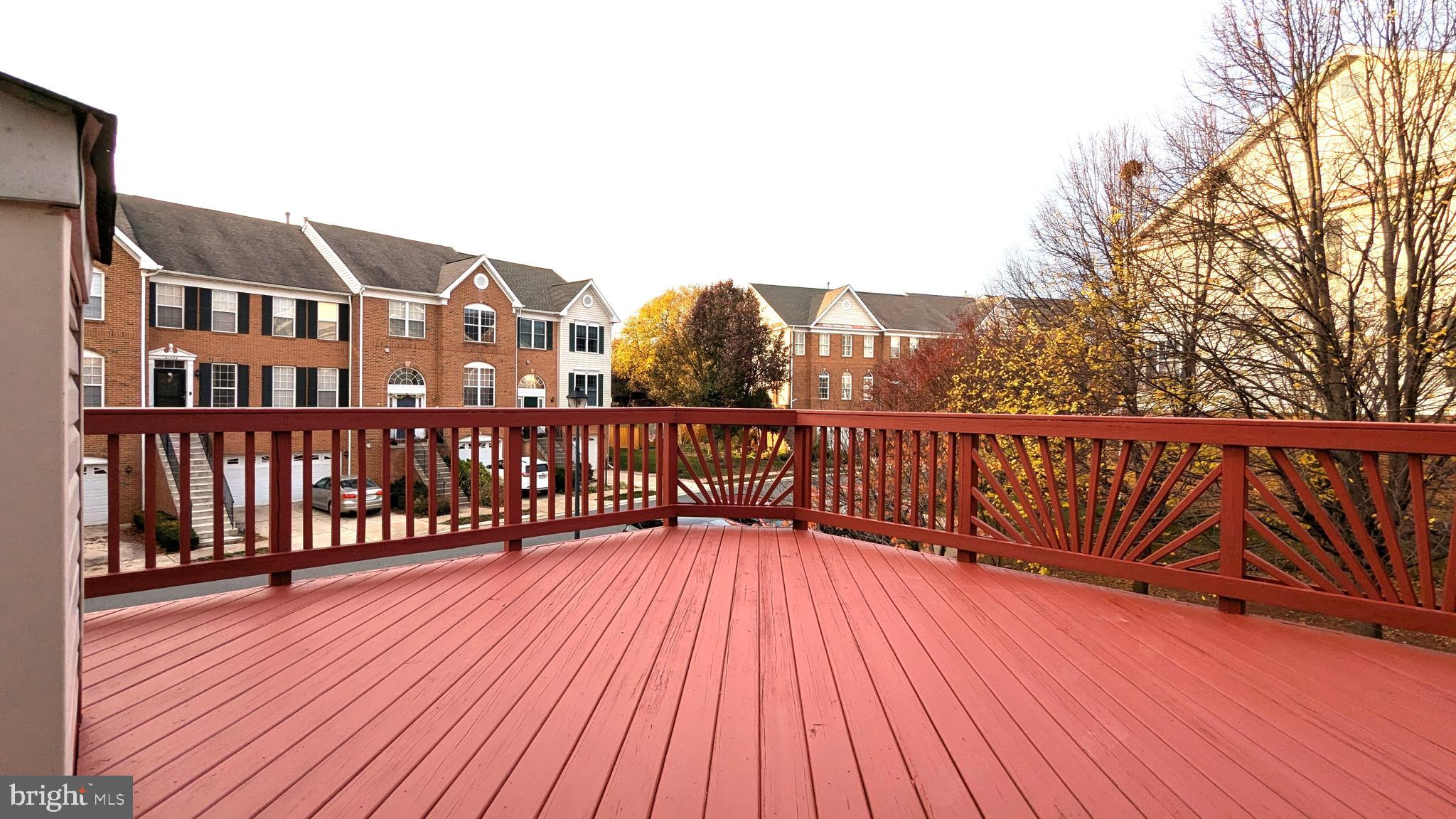 21506 Trowbridge Square Ashburn, VA 20147 - Photo 13 of 66 a view of a houses with wooden deck