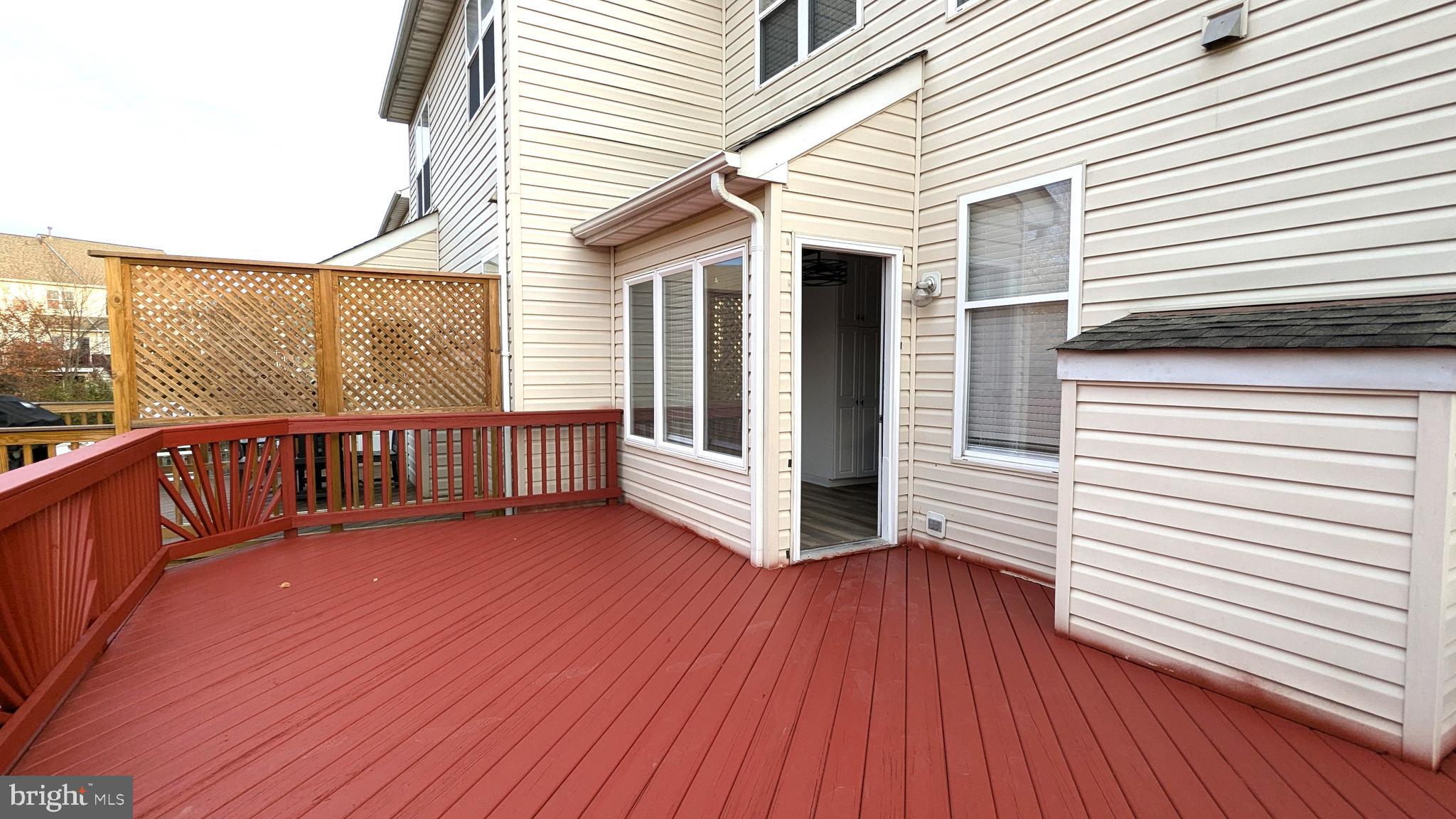 21506 Trowbridge Square Ashburn, VA 20147 - Photo 16 of 66 a view of a house with wooden deck