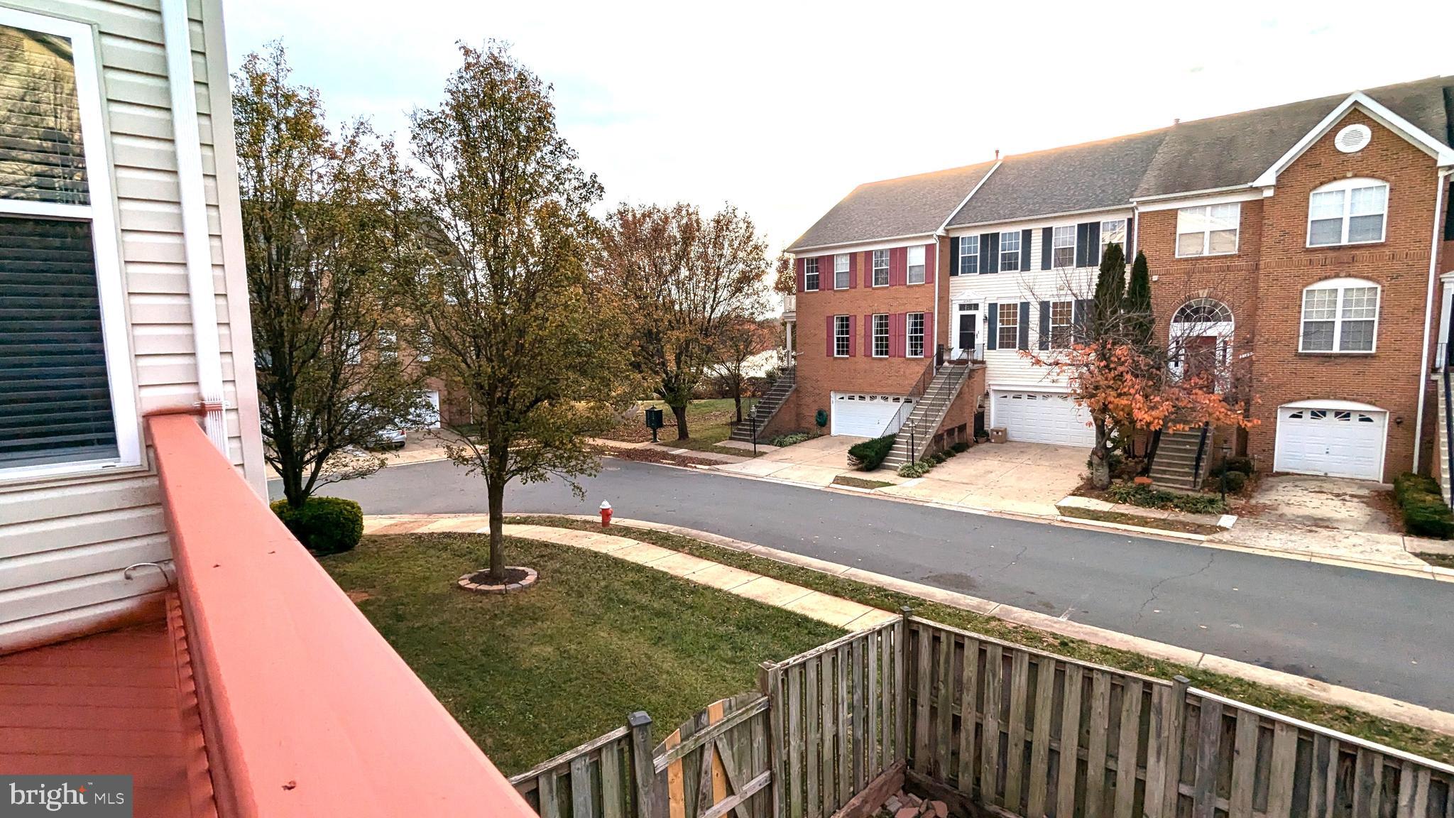 21506 Trowbridge Square Ashburn, VA 20147 - Photo 17 of 66 a view of a brick building next to a yard
