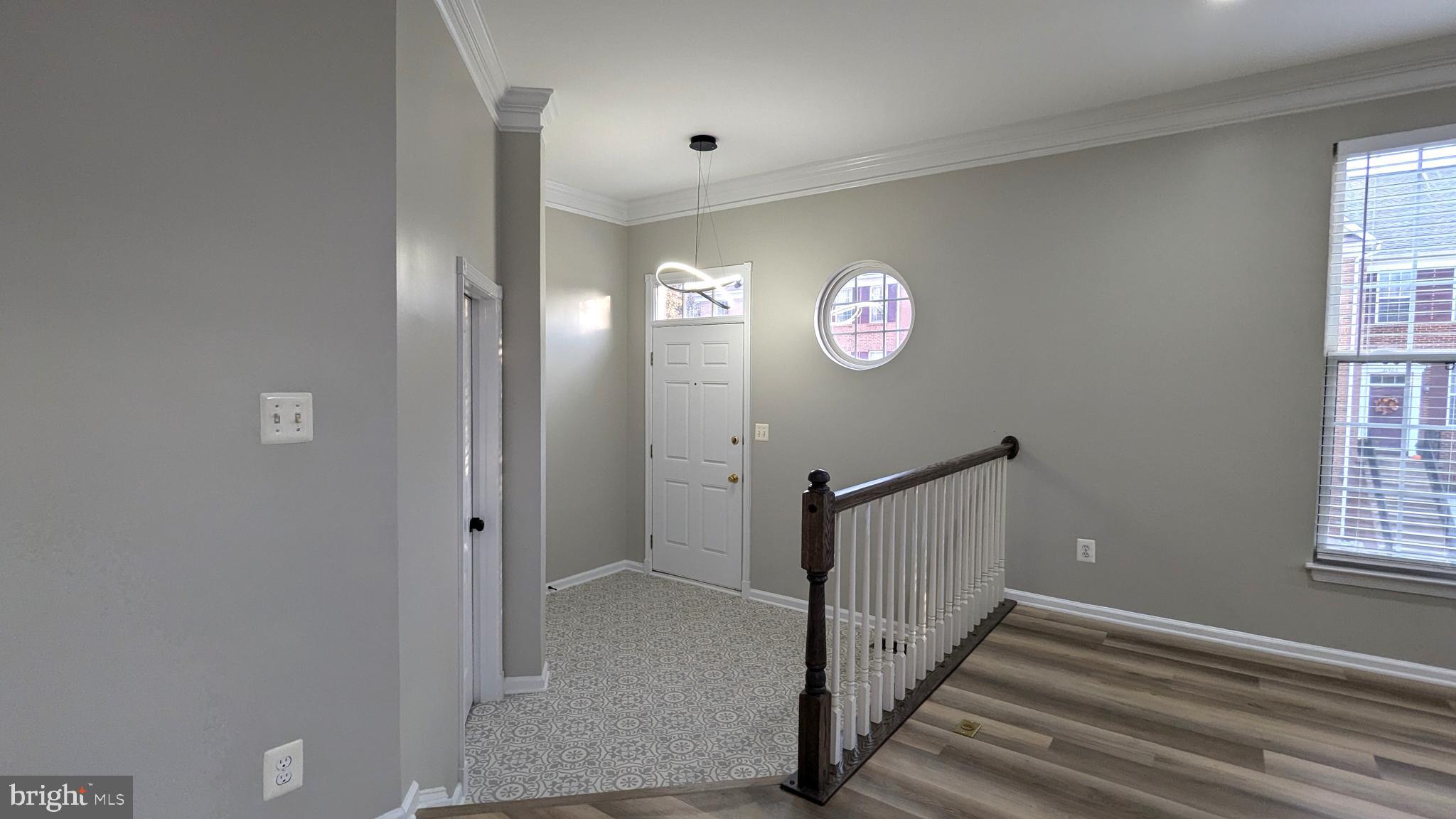 21506 Trowbridge Square Ashburn, VA 20147 - Photo 2 of 66 a view of an entryway with wooden floor