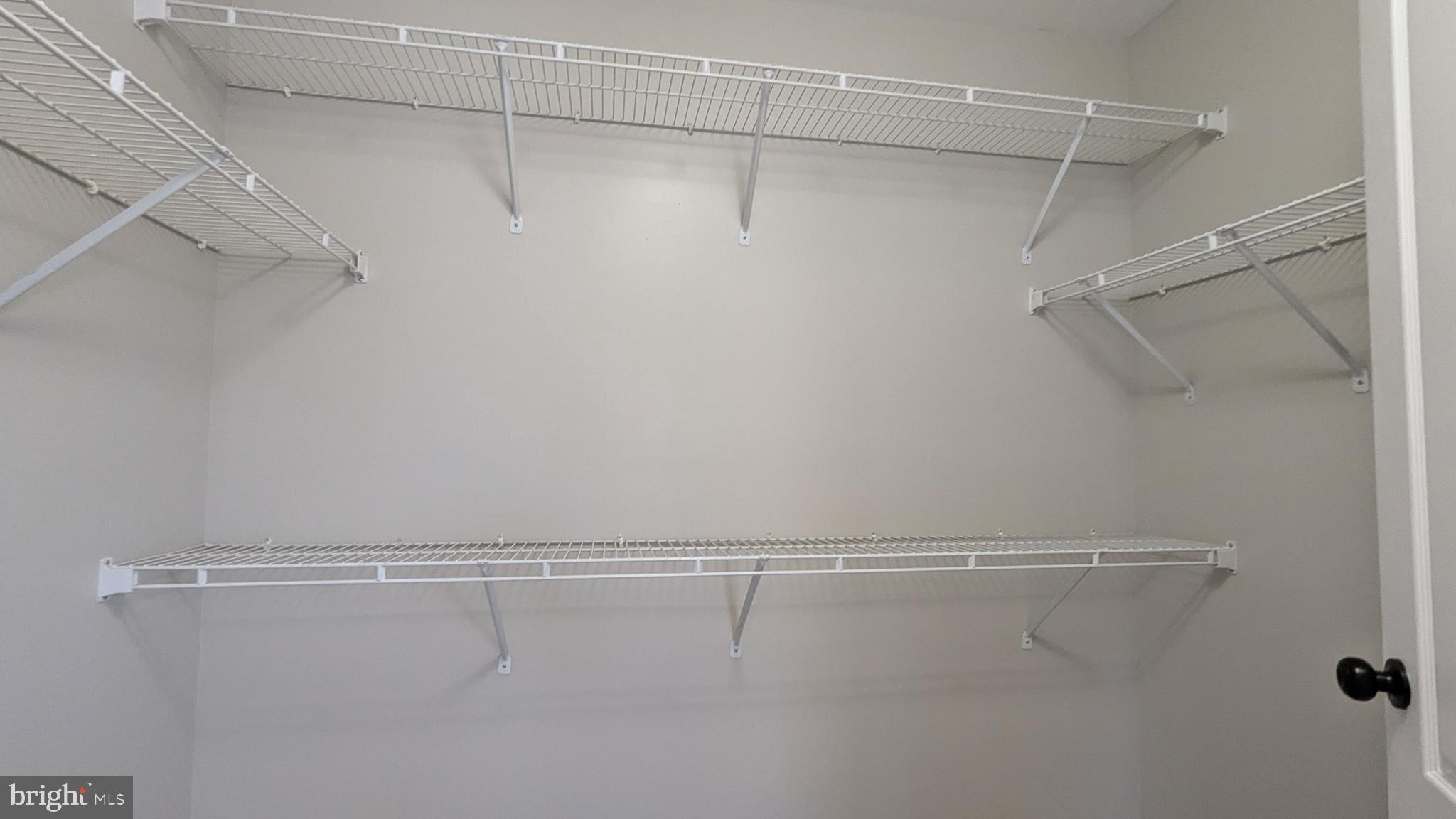 21506 Trowbridge Square Ashburn, VA 20147 - Photo 29 of 66 a view of a room with racks on the wall