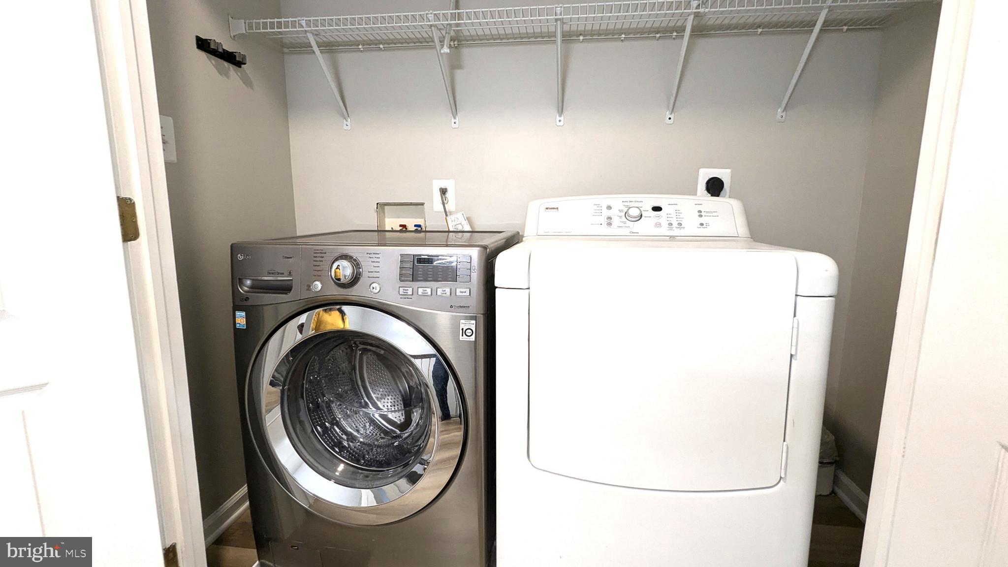 21506 Trowbridge Square Ashburn, VA 20147 - Photo 30 of 66 a utility room with dryer and washer