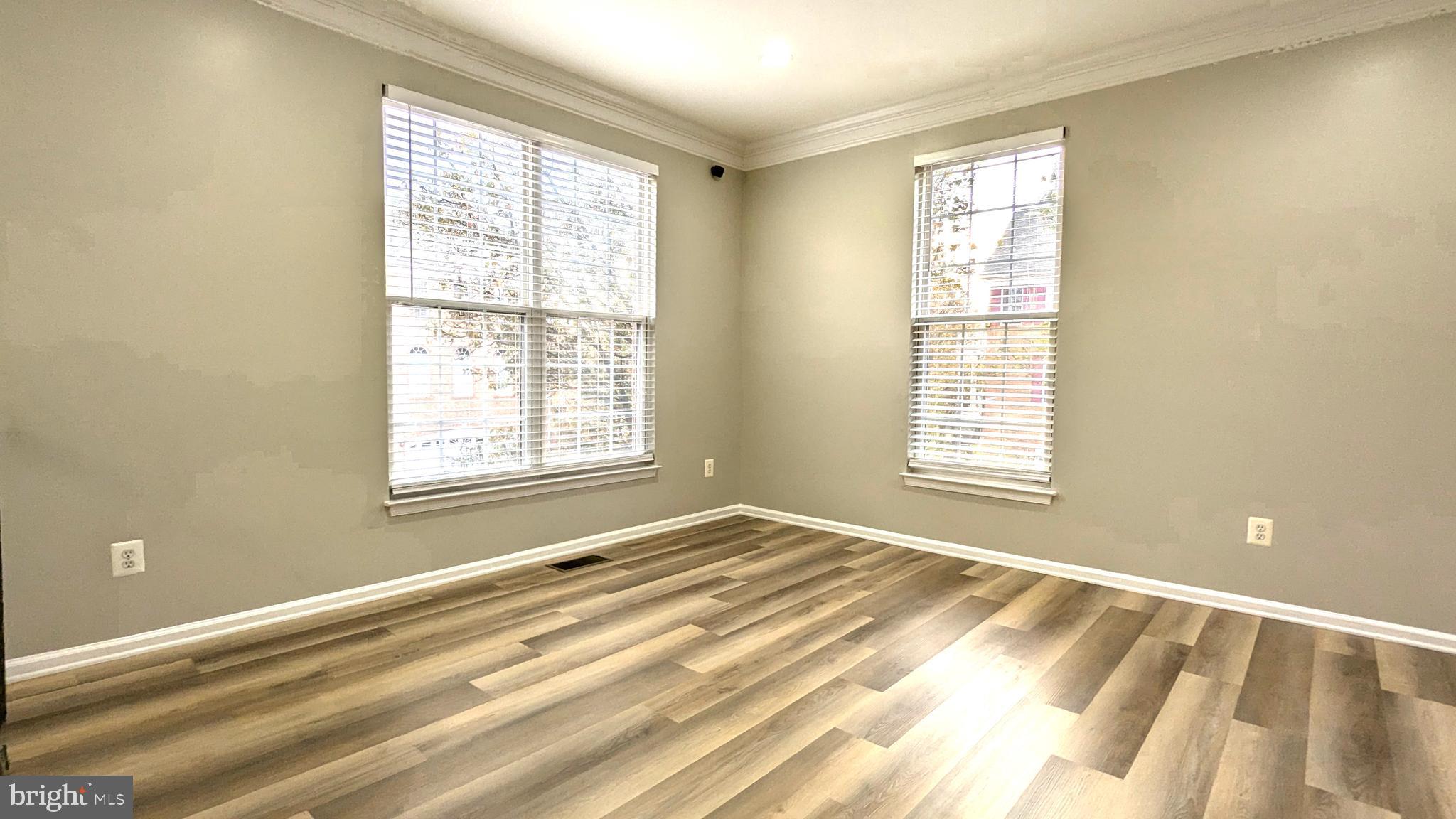 21506 Trowbridge Square Ashburn, VA 20147 - Photo 32 of 66 a view of a bedroom with a bed and a window