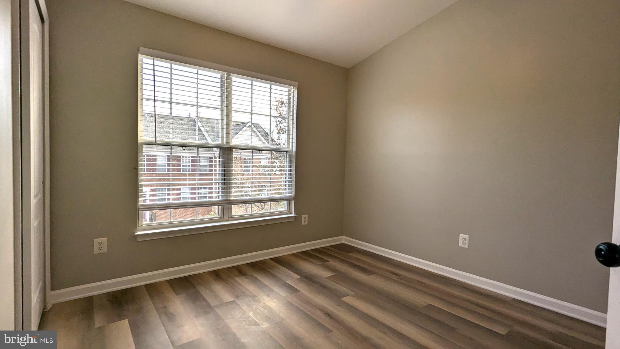 21506 Trowbridge Square Ashburn, VA 20147 - Photo 35 of 66 a view of empty room with wooden floor