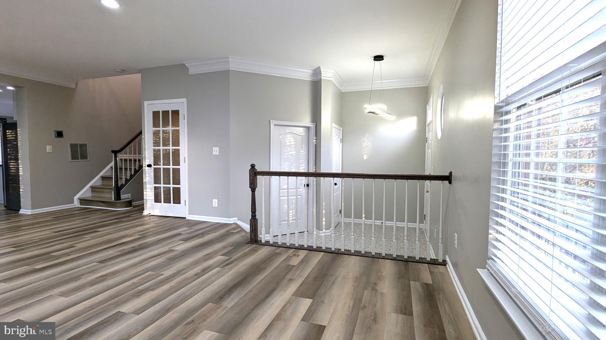 21506 Trowbridge Square Ashburn, VA 20147 - Photo 4 of 66 a view of entryway with wooden floor