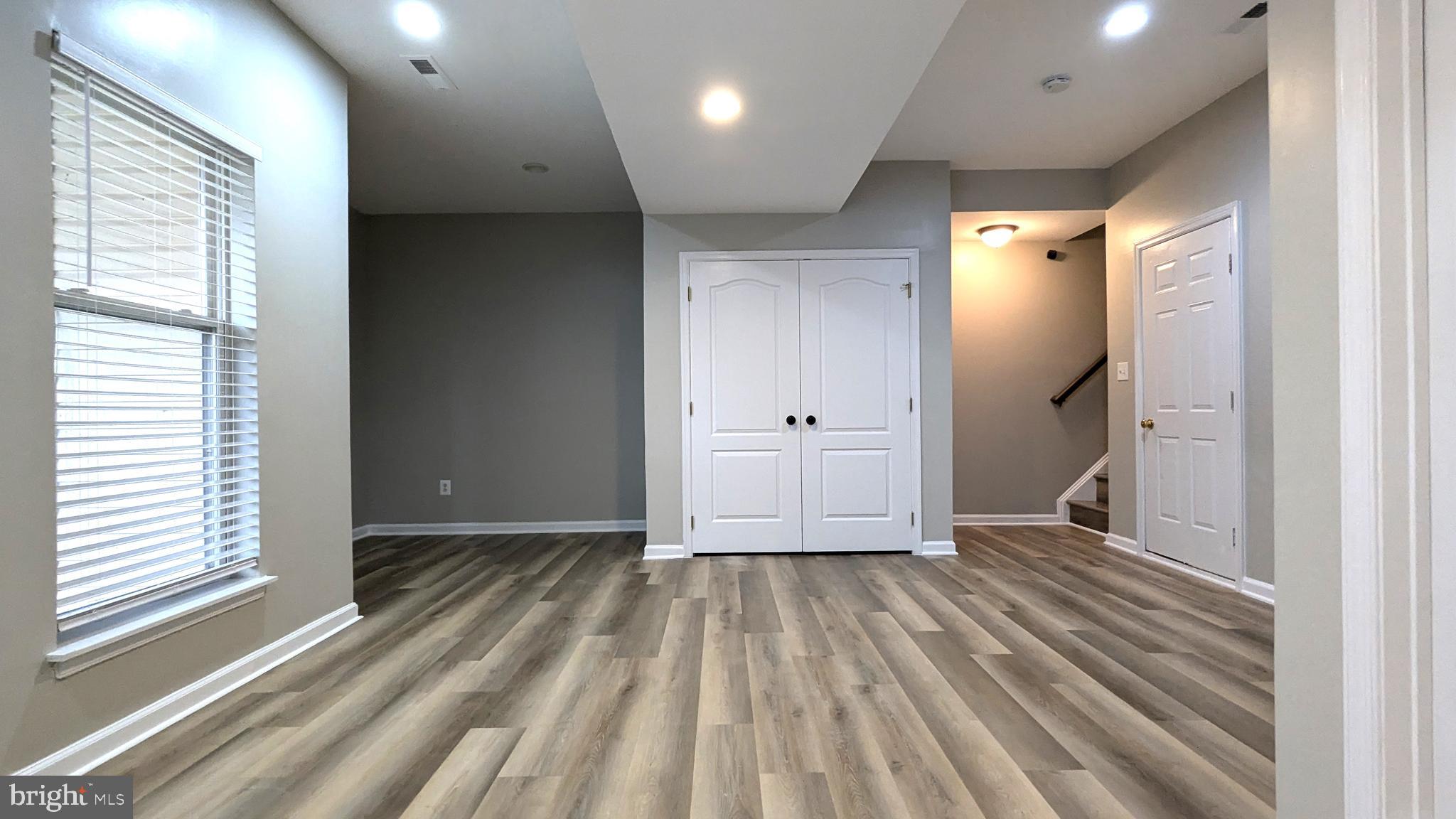 21506 Trowbridge Square Ashburn, VA 20147 - Photo 45 of 66 a view of empty room with wooden floor and fan